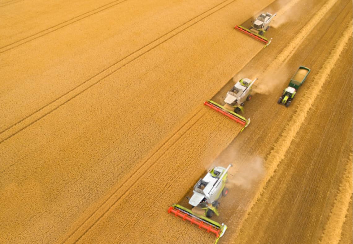 photo of tractor harvesting crops